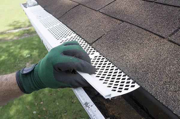 gutter guards prevent clogs and debris buildup in your gutters by covering the gutter opening with a protective barrier